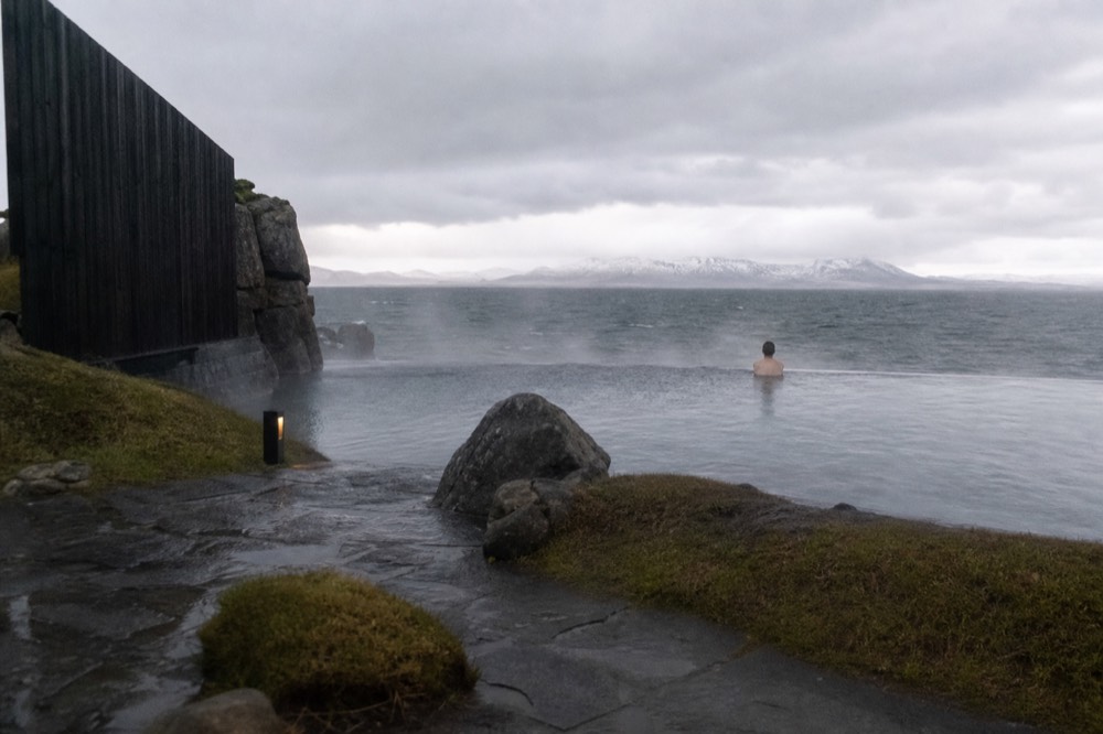 A steaming infinity-edge pool overlooking a cold North Atlantic sea